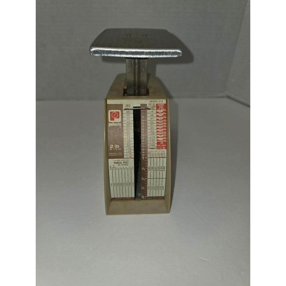 vintage Pelouze Model P-2 postal scale designed to weigh parcels up to 2 pounds.